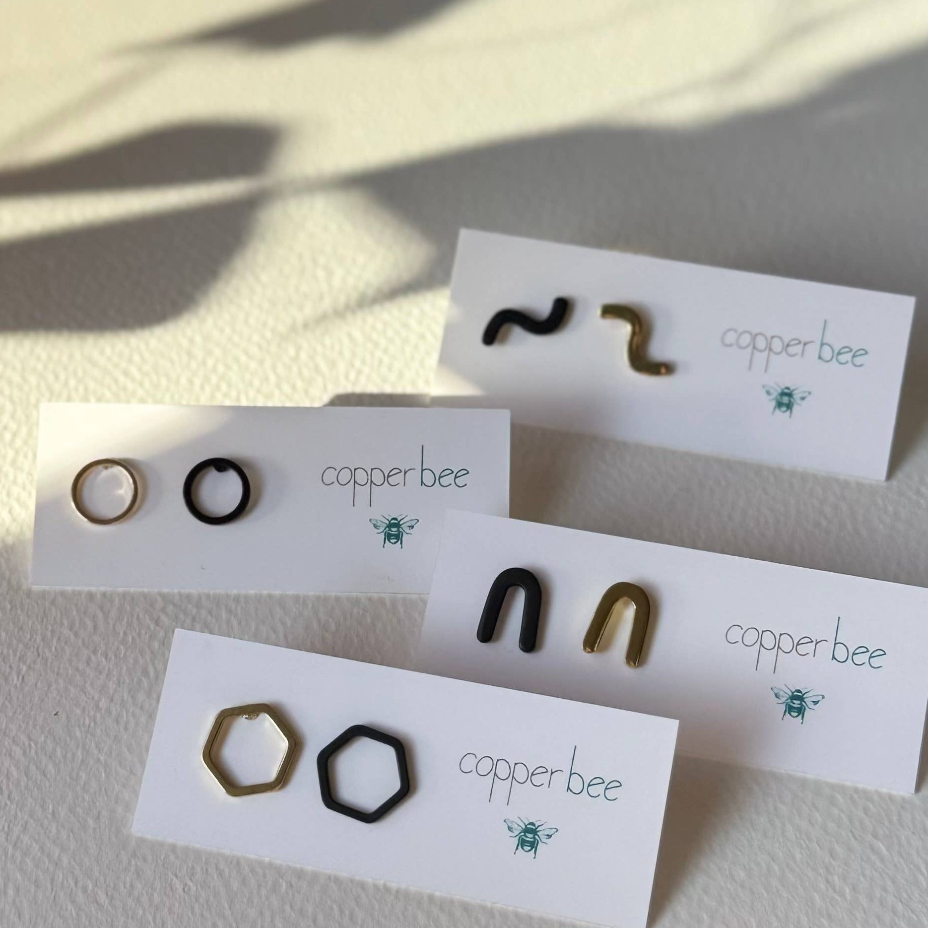 Mismatched Arch Earrings | Black & Brass Geometric Studs