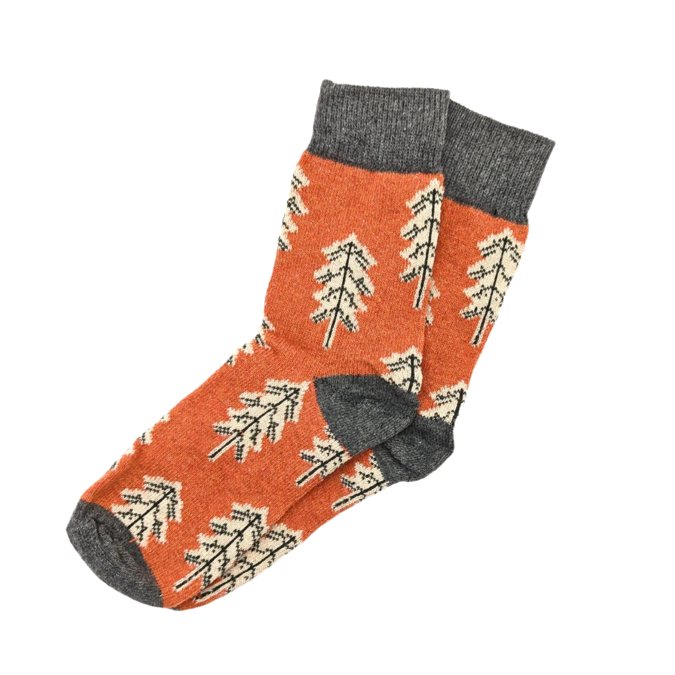 orange winter socks with little leafs on them