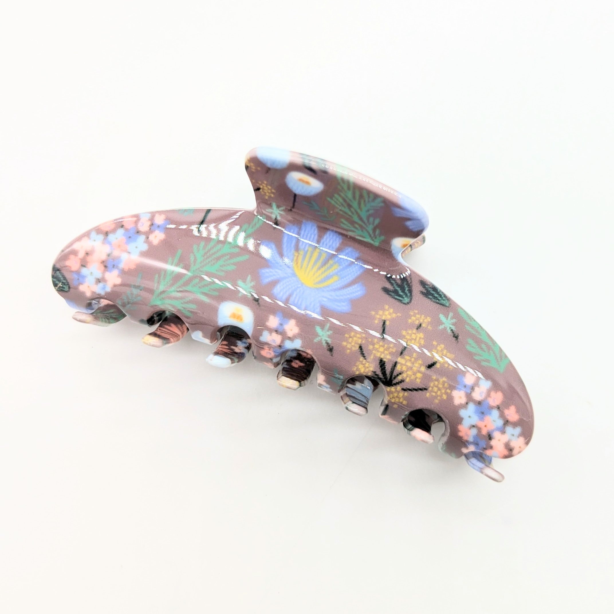 Floral-patterned hair clip on a white background